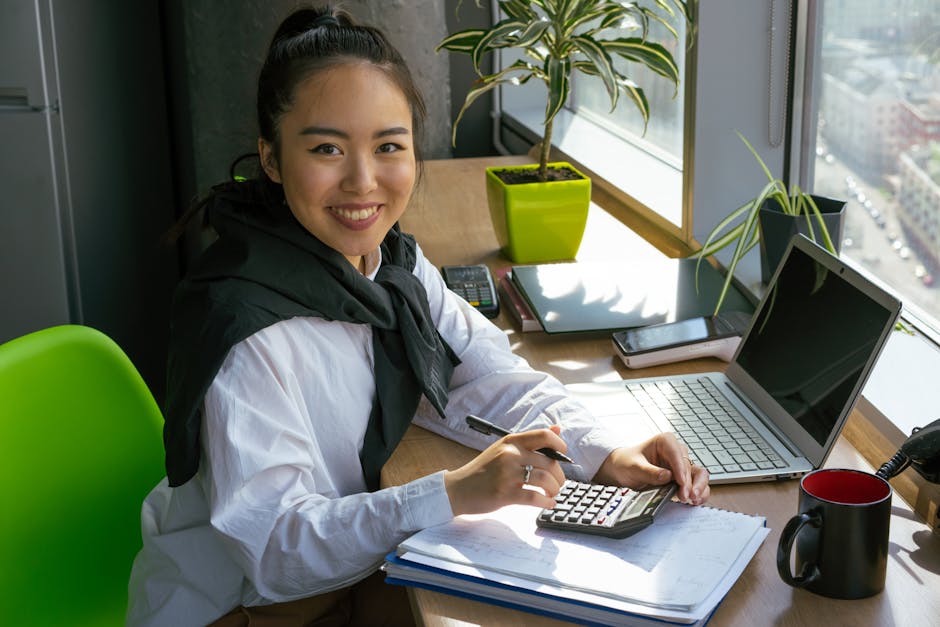 Accountant working at desk with financial documents